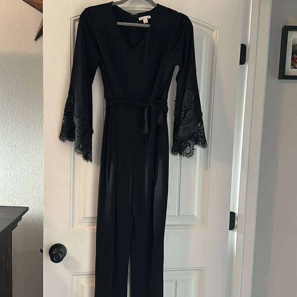 Super cute jumper suit w/black lace sleeves and waist tie